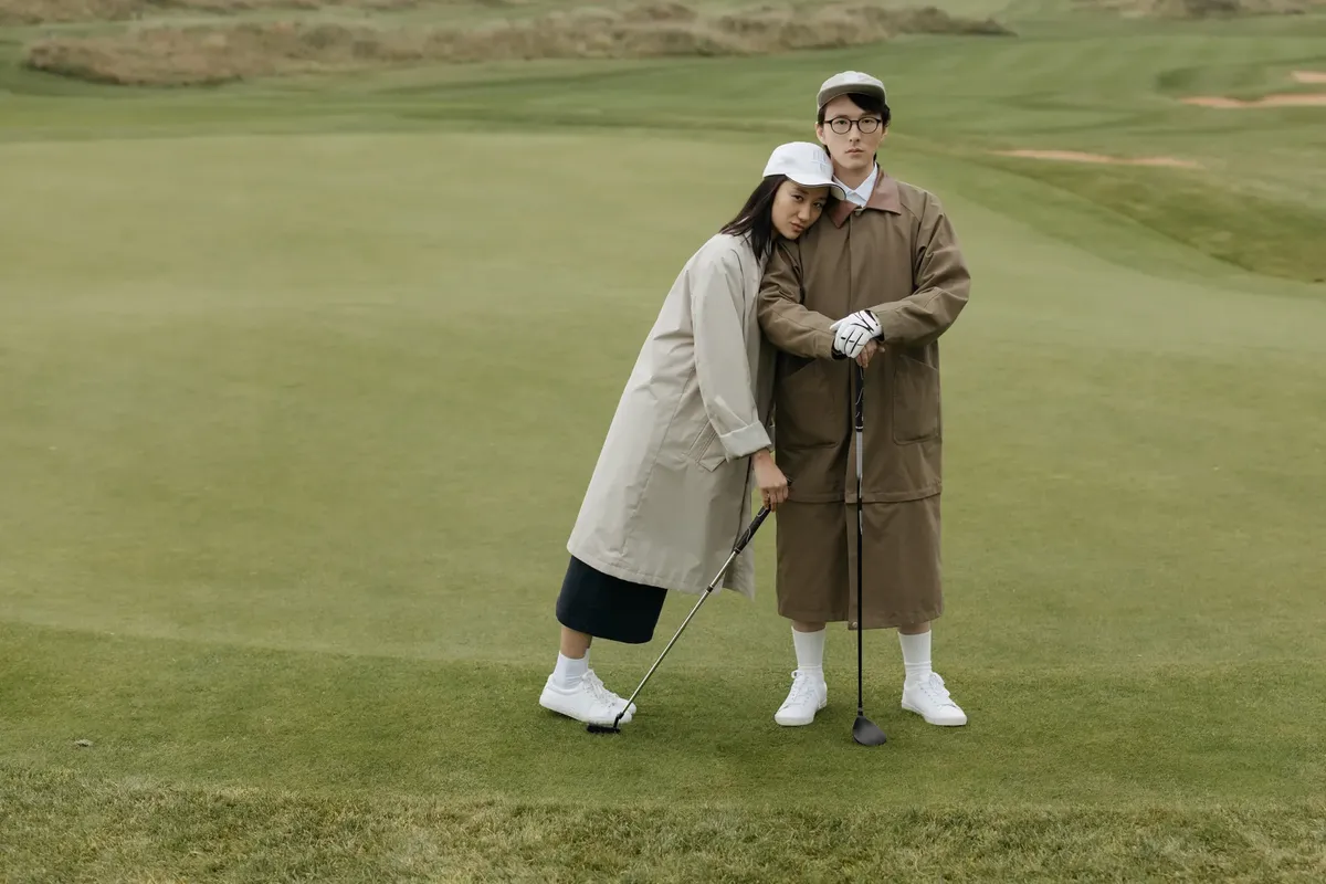 Couple enjoying golf together in casual attire. Perfect for leisure and sports themes.