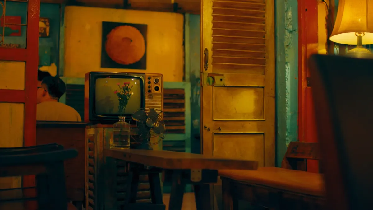A cozy indoor setting with a retro TV, vintage decor, and warm lighting ambiance.
