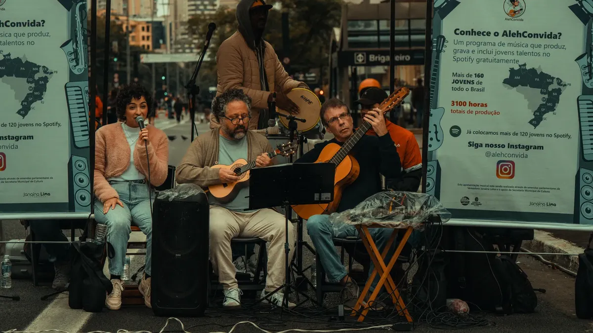 Live street performance with a band of musicians playing instruments in a urban setting.